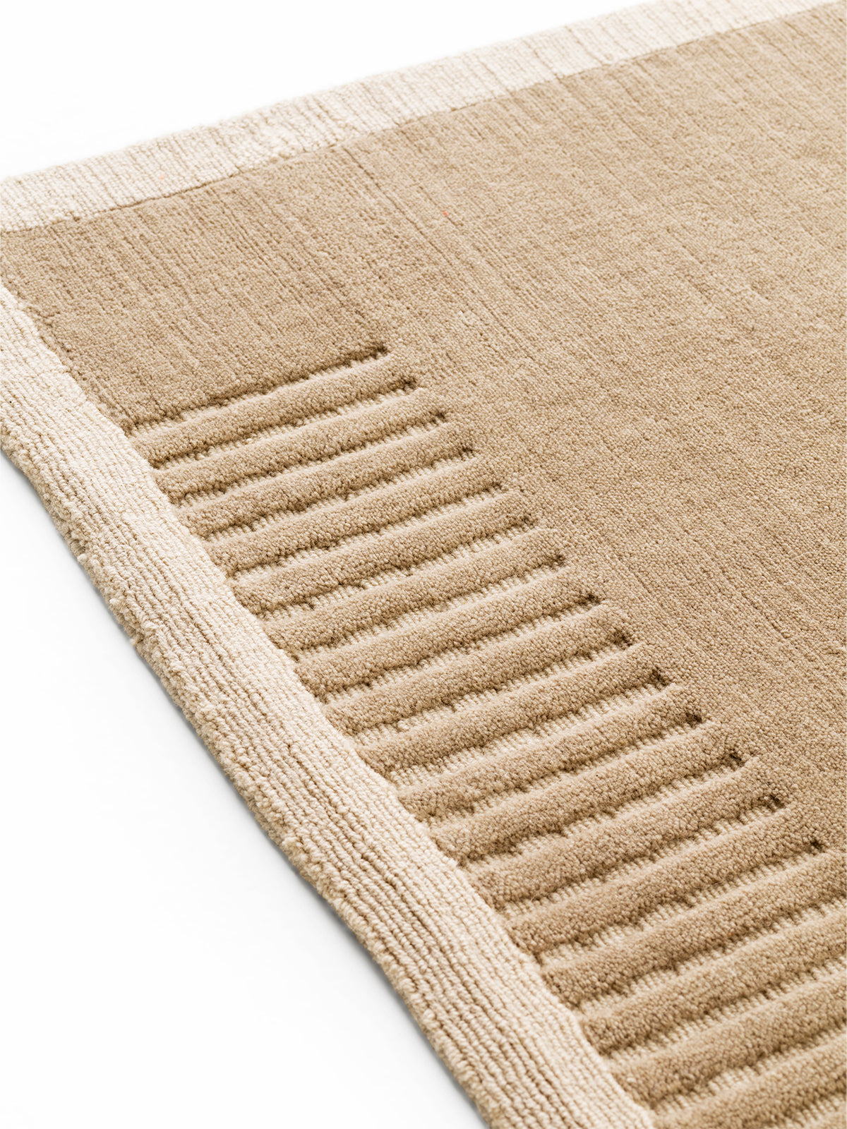 Beige textured wool rug with ribbed stripe pattern and light stitched border,