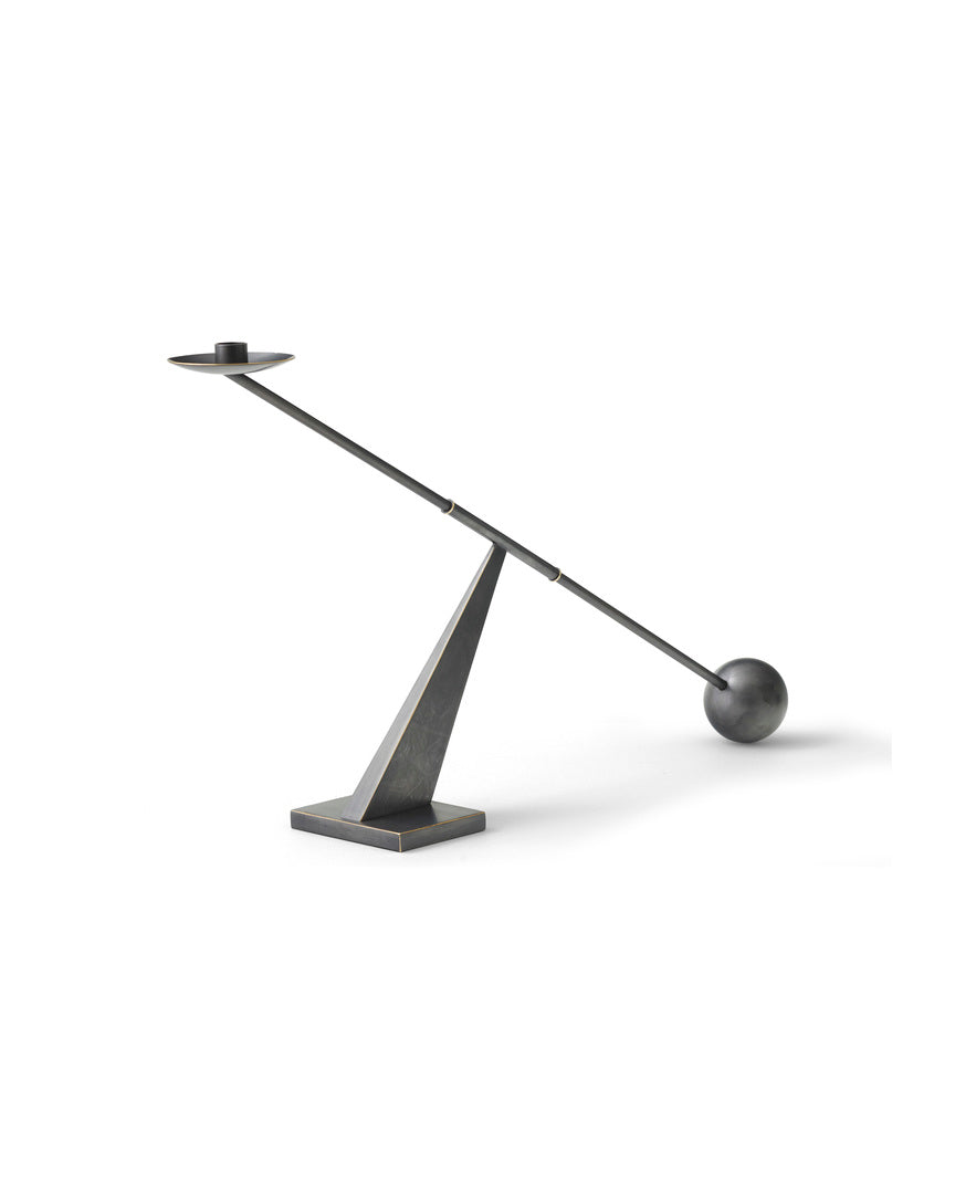Minimalist dark metal desk lamp with a triangular base, long angled rod