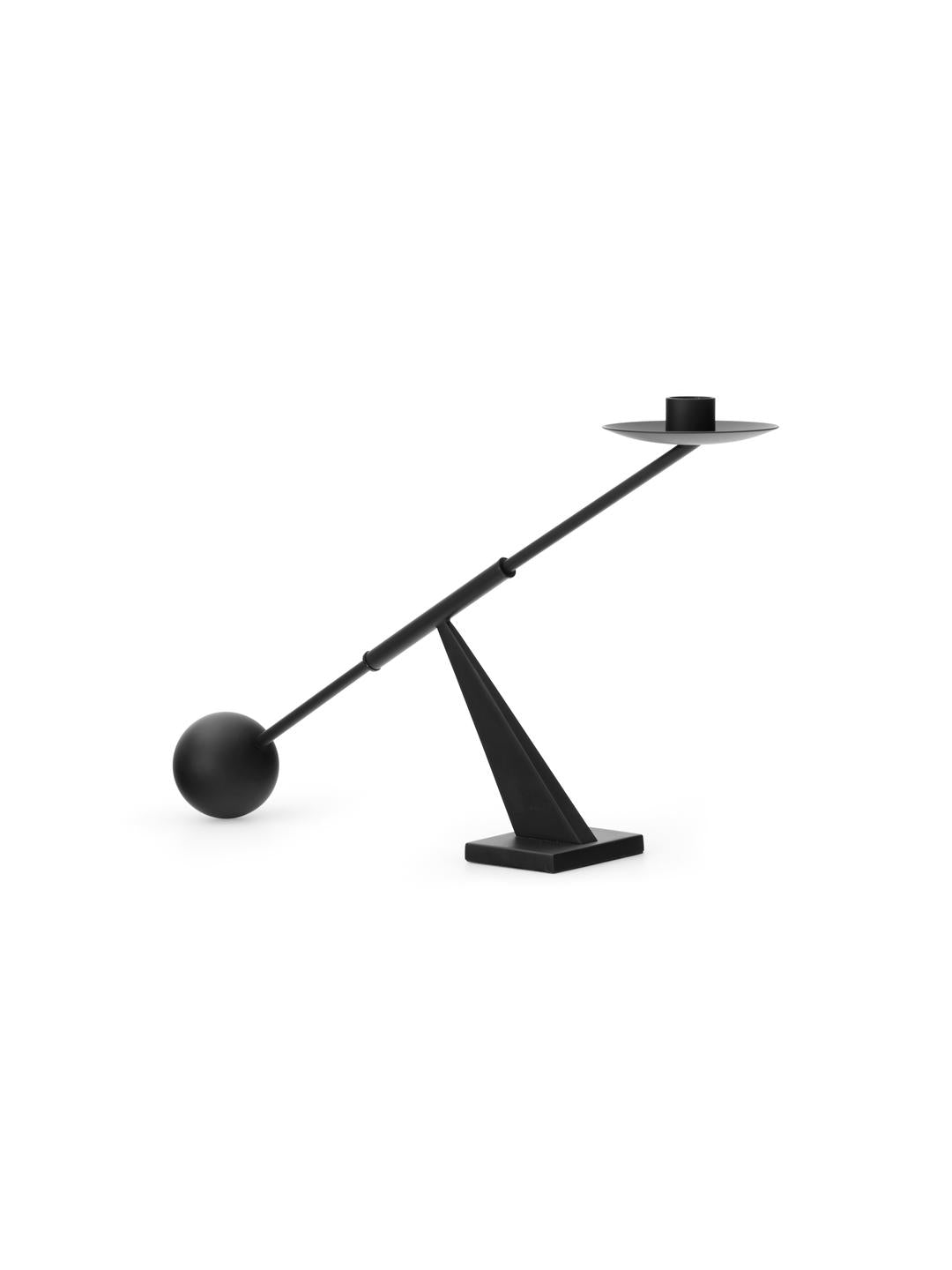 Matte black balancing table lamp with triangular base, long angled rod, spherica