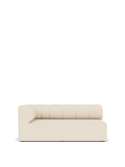 Front view of the Eave Seamline Modular Sofa corner piece in a light fabric, showing its channel-tufted back and rounded arm.