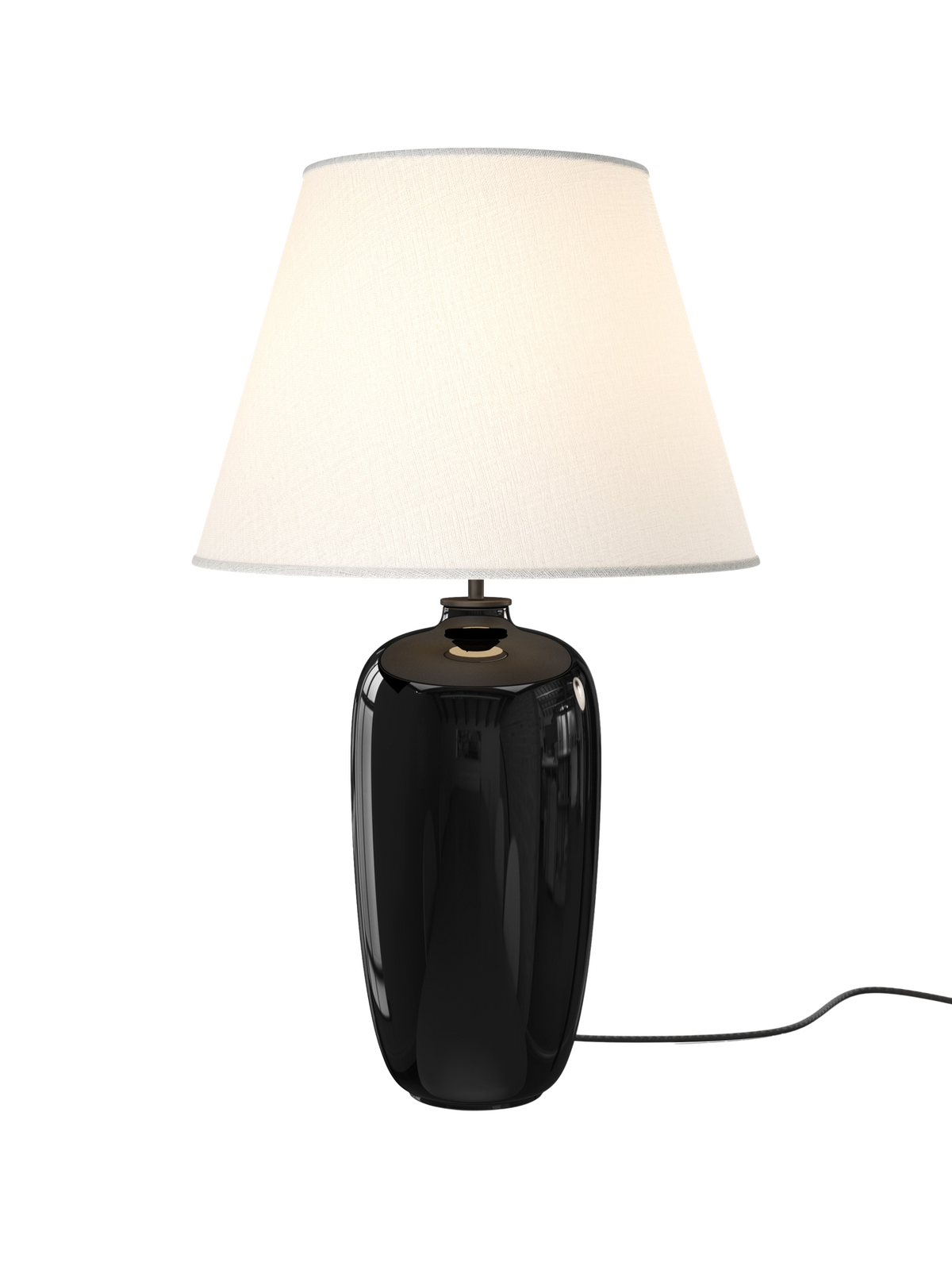Torso Table Lamp, 57 in black-glazed stoneware with an off-white linen shade, shown illuminated against a black background.