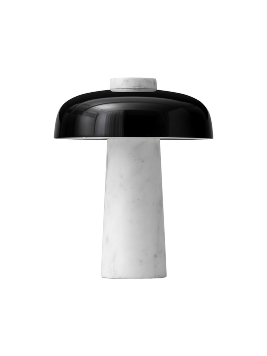 The Reverse Table Lamp has a tapered white marble base, a glossy black dome shade, and a marble top detail.