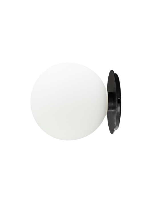 A side view of the TR Bulb Ceiling/Wall Lamp, showing its oval white opal glass shade attached to a black circular base.