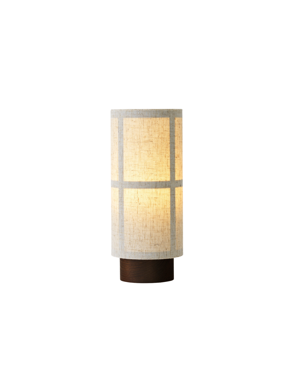 Hashira Table Lamp, Portable in raw linen with warm glowing light, shown from an angle against a black background.