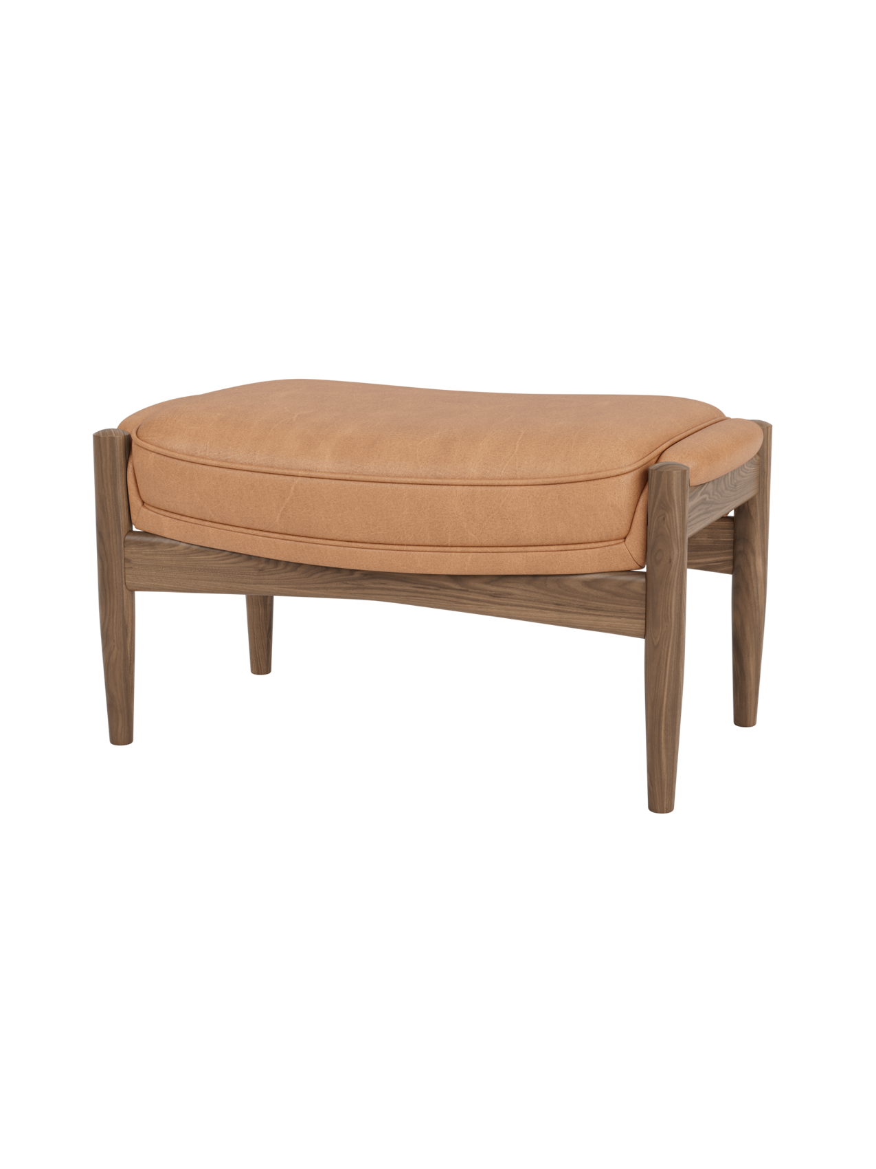 The Seal Ottoman in walnut wood with Dunes Camel leather upholstery, highlighting its organic mid-century silhouette.