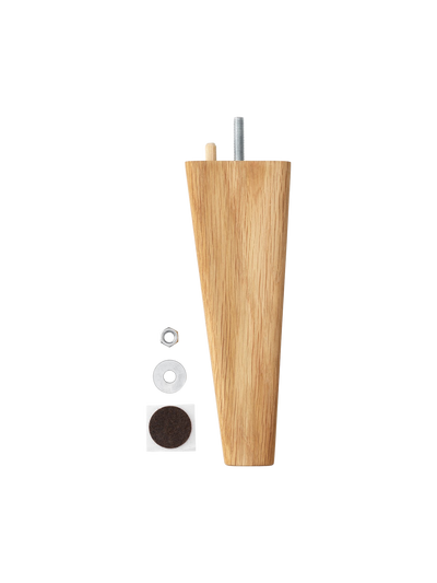 A tapered furniture leg in light oak against a black background with its hardware: a nut, washer, and felt pad.
