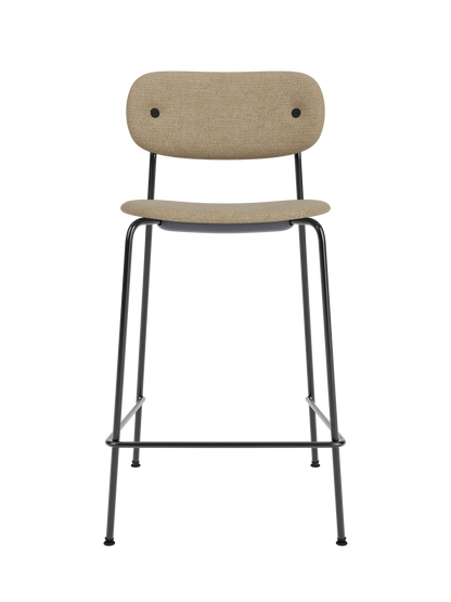 Co Counter Chair in Audo Bouclé 02 upholstery with a black steel frame, viewed from the front against a black background.