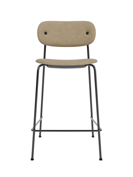 Co Counter Chair in Audo Bouclé 02 upholstery with a black steel frame, viewed from the front against a black background.