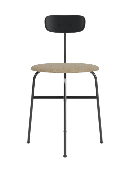 Afteroom Dining Chair with a beige bouclé upholstered seat, black oak backrest and a minimalist black steel frame.