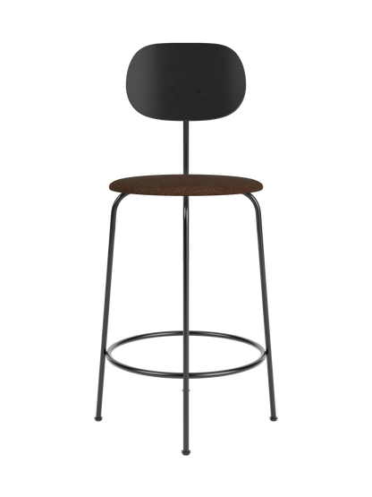 Afteroom Counter Chair Plus with a black oak backrest, brown bouclé upholstered seat and black powder-coated steel frame.