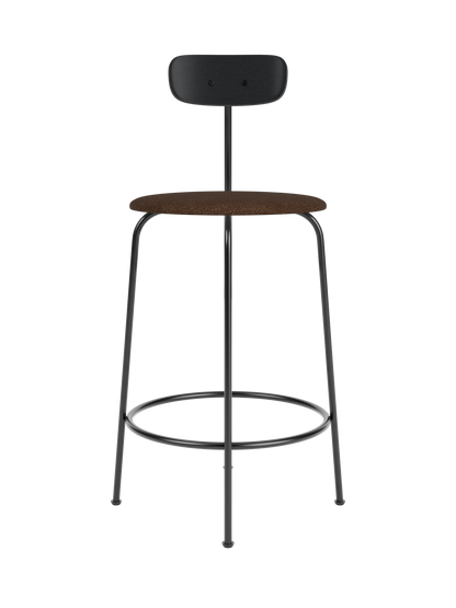 Afteroom Counter Chair featuring a black painted oak backrest and brown bouclé upholstered seat on black steel legs.