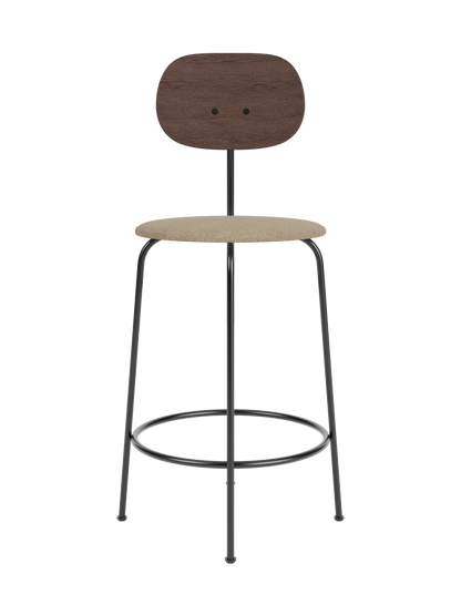 Afteroom Counter Chair Plus featuring a dark stained oak backrest and upholstered beige bouclé seat on a black steel frame.