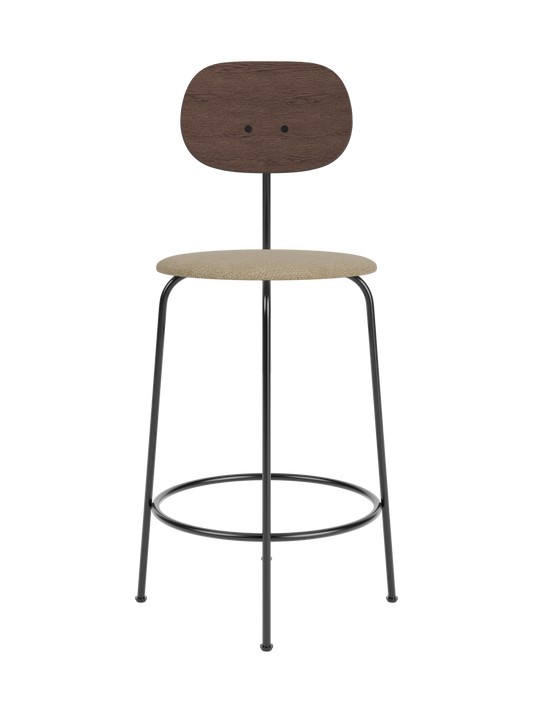 Afteroom Counter Chair Plus featuring a dark stained oak backrest and upholstered beige bouclé seat on a black steel frame.