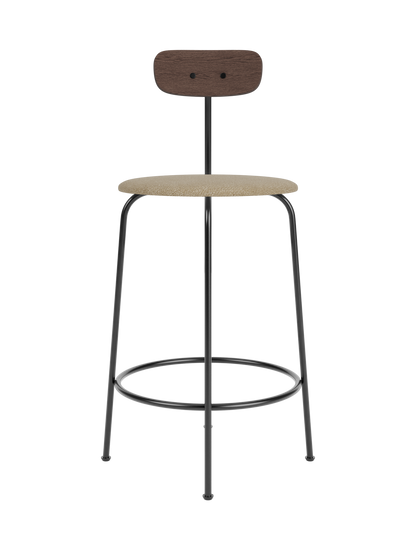 Afteroom Counter Chair with a beige bouclé seat, dark stained oak backrest and minimalist black steel frame.
