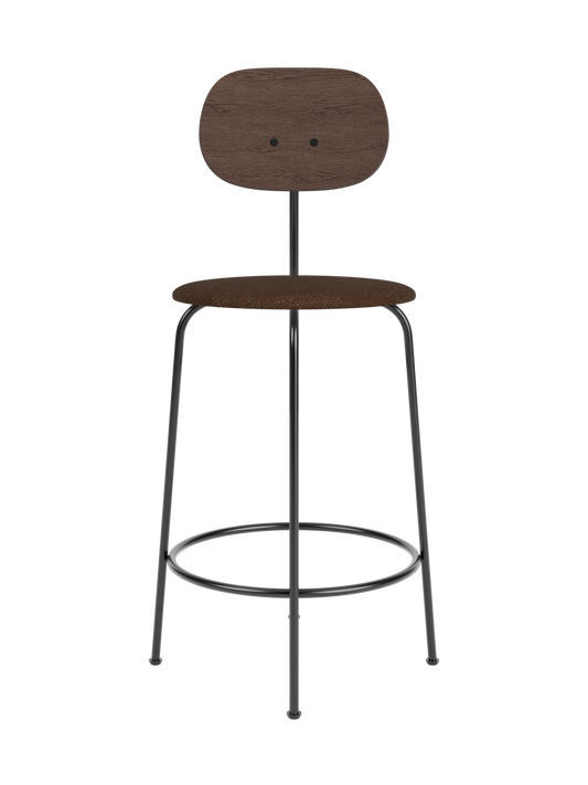 Afteroom Counter Chair Plus with a dark stained oak backrest and brown bouclé upholstered seat on a black metal frame.