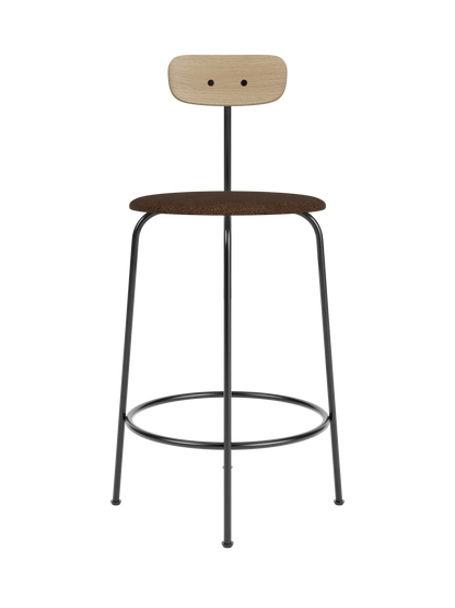 Afteroom Counter Chair featuring a black metal frame, brown bouclé upholstered seat and a light natural oak backrest.