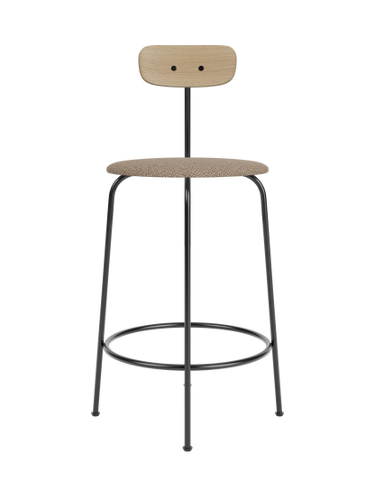 Afteroom Counter Chair with a Logan Flint upholstered seat, natural oak backrest and a minimalist black steel frame.