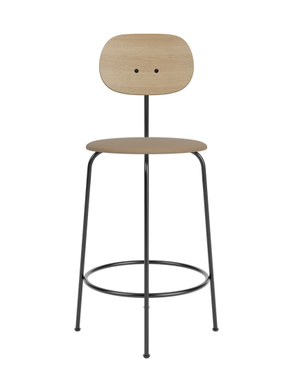 Afteroom Counter Chair Plus with natural oak backrest and brown upholstered seat on a minimalist black steel frame.