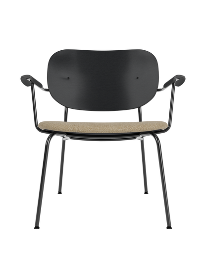 Co Lounge Chair featuring a black oak backrest, beige Audo Bouclé upholstered seat and a slim black steel frame.