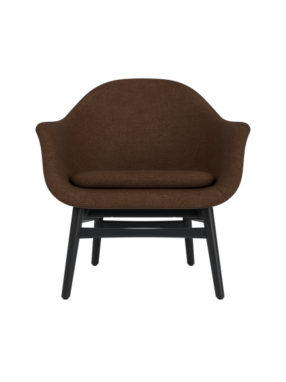 Harbour Lounge Chair featuring dark brown bouclé upholstery and a minimalist black painted oak base.