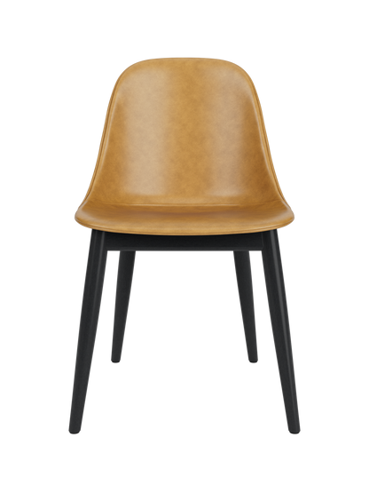 Tan leather Harbour Side Dining Chair with black painted oak legs, front view on a white background.