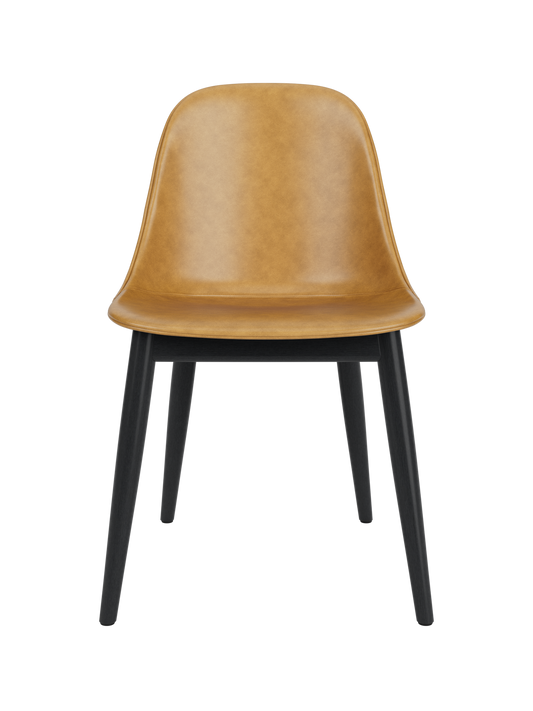 Tan leather Harbour Side Dining Chair with black painted oak legs, front view on a white background.