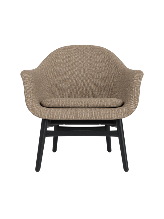 Harbour Lounge Chair featuring Logan Flint textured upholstery and a black painted oak base with a curved shell.