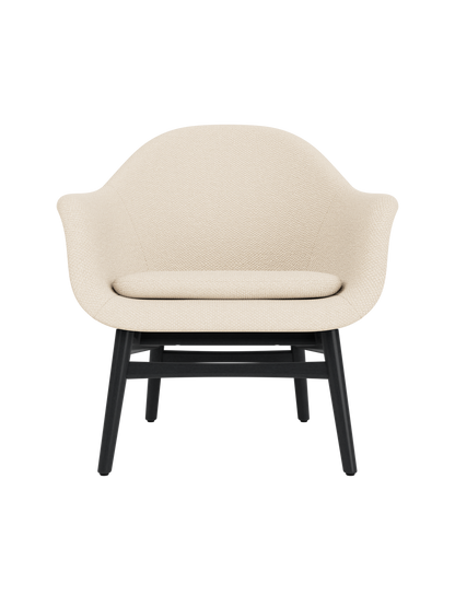 Sculptural Harbour Lounge Chair in cream Logan Jasmine upholstery with a solid black painted oak wood base.