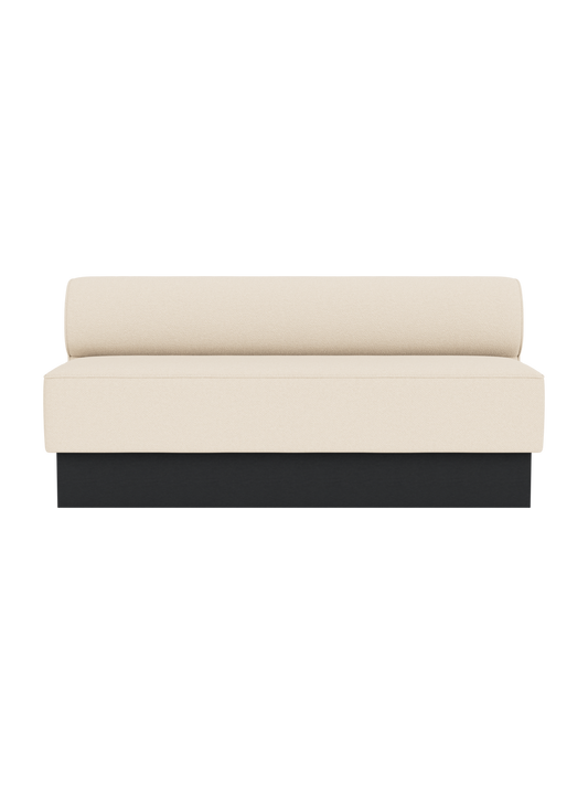 Eave Dining Sofa in Logan Jasmine upholstery with black painted oak base, viewed from the front.