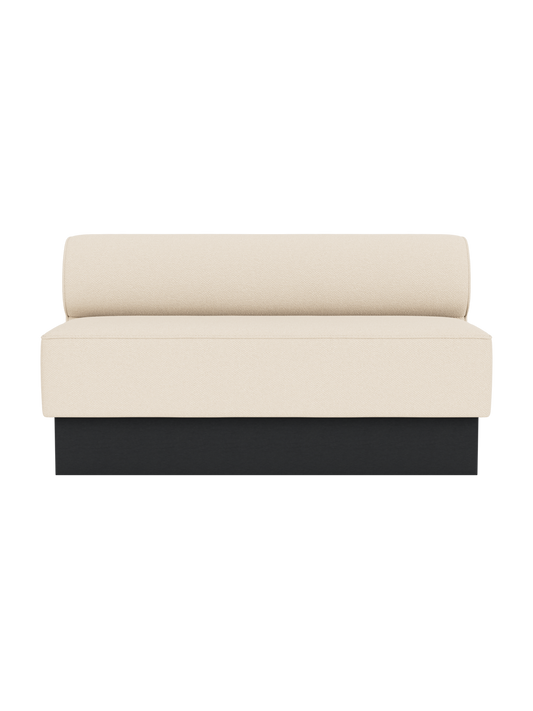 Eave Dining Sofa, Plateau upholstered in Logan Jasmine fabric with a black painted oak base.