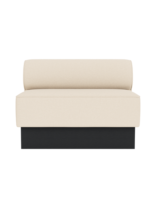 Eave Dining Sofa, Plateau in Logan Jasmine upholstery with a black painted oak base, viewed from the front.