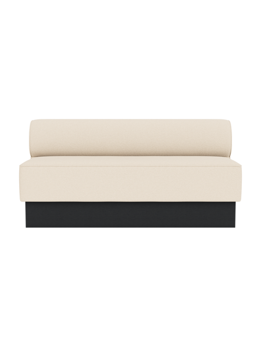 Eave Dining Sofa, Plateau upholstered in Logan Jasmine fabric with a black painted oak base, viewed from the front.