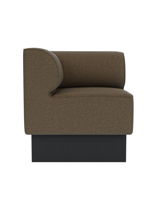 Eave Dining Sofa, Plateau corner module in Logan Nutmeg fabric with a black painted oak base, viewed from the side.