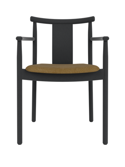 Merkur Dining Chair with armrests in black stained oak featuring a textured golden Audo Bouclé 06 upholstered seat.