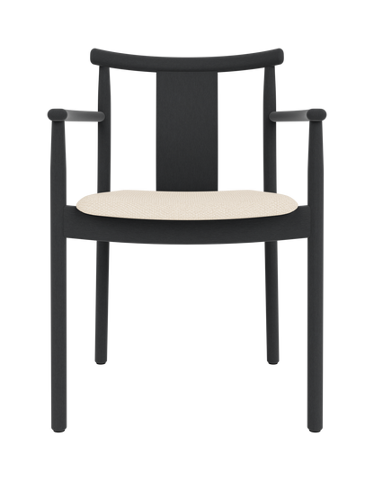 Merkur Dining Chair with armrests in black stained oak, featuring a cream Logan Jasmine fabric upholstered seat.