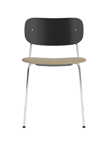 Co Dining Chair with a black oak veneer back, beige bouclé upholstered seat and a sleek chrome steel frame.
