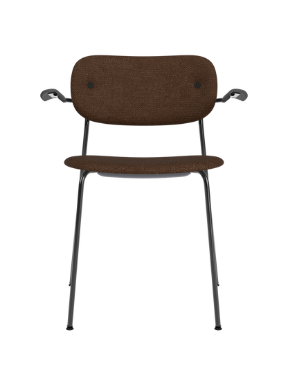 Co Dining Chair with armrests, upholstered in textured brown bouclé fabric on a black powder-coated steel base.