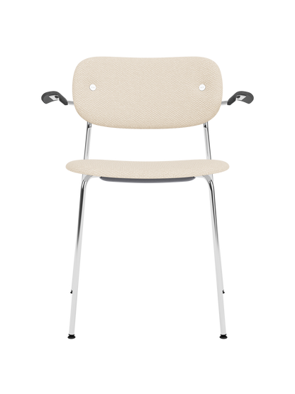 Co Dining Chair in Logan Jasmine upholstery with black armrests and a slender chrome frame on a white background.
