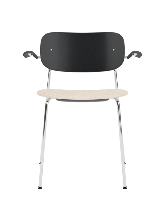 Co Dining Chair with armrests, featuring a black oak back and Logan Jasmine upholstered seat on a slim chrome frame.