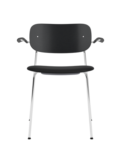 Co Dining Chair with armrests featuring a chrome frame, black painted oak backrest and black Sierra 1001 upholstered seat.