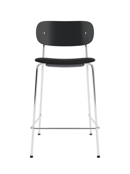 Co Counter Chair in black painted oak and chrome with a black upholstered seat against a black background.