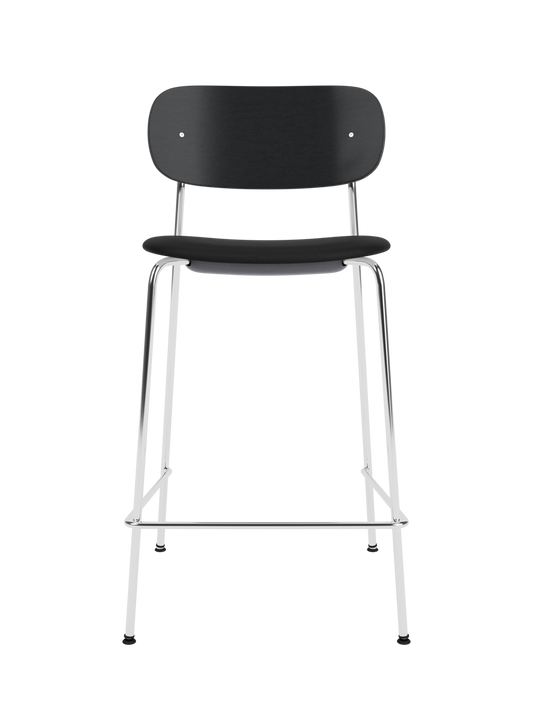 Co Counter Chair in black painted oak and chrome with a black upholstered seat against a black background.