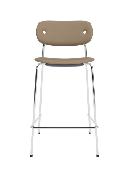 Co Counter Chair, Fully Upholstered with beige leather upholstery and chrome steel frame on a black background.