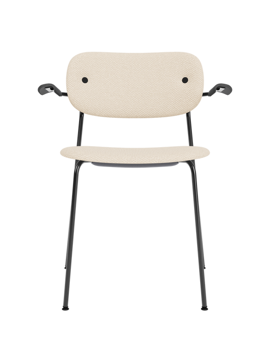 Co Dining Chair with armrests, fully upholstered in Logan Jasmine fabric with a black oak frame and steel legs.