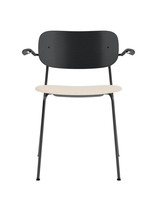 Co Dining Chair with armrests, featuring a black oak backrest and beige Logan Jasmine upholstered seat on a black frame.
