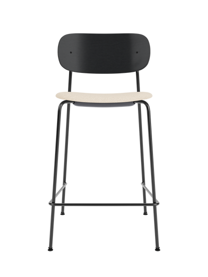 Co Counter Chair with black painted oak backrest, Logan Jasmin upholstered seat and slender black tubular steel frame.