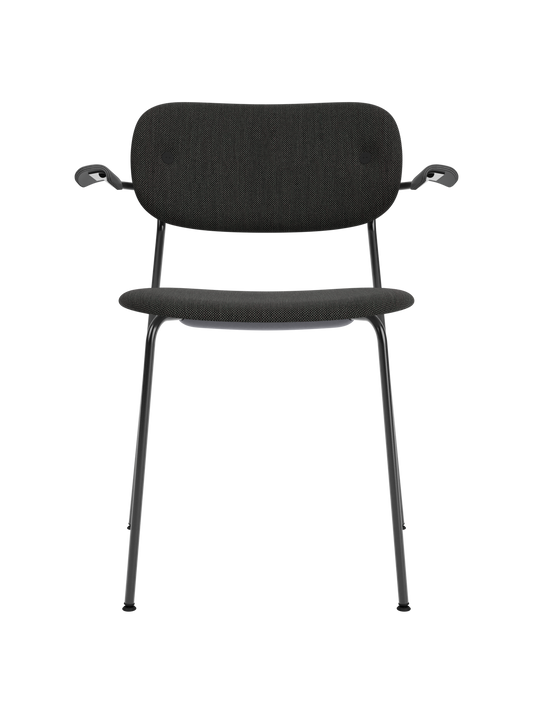 Fully upholstered Co Dining Chair with black oak armrests, black Re-wool fabric, and a powder-coated steel frame.