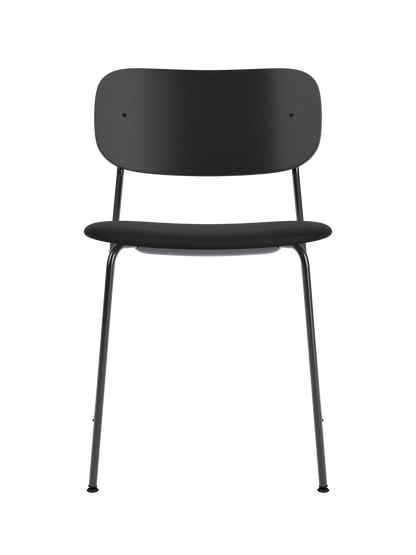 Black Co Dining Chair featuring a black painted oak backrest and upholstered seat on a slender steel frame.