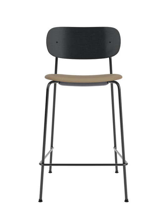 Black oak Co Counter Chair featuring a tan Sierra upholstered seat and slender black steel frame with a footrest.