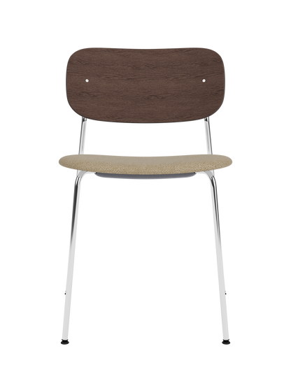 Co Dining Chair with a sleek chrome frame, dark stained oak backrest and beige bouclé upholstered seat.